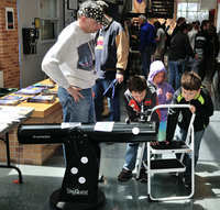 Michael P watching the Kid Powered Telescope (KPT) in action!